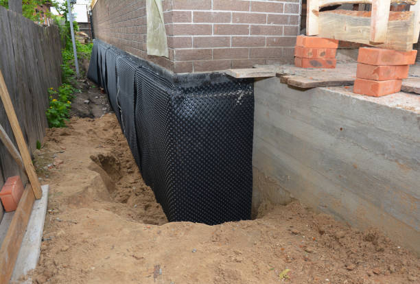 SJ Waterproofing Pros technician performing targeted Emergency Waterproofing assessment in Mitchell, IN